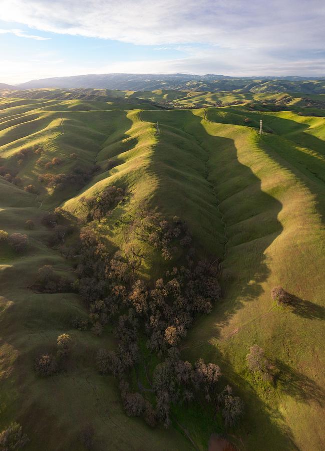 Nature Photograph - Morning Sunlight Shines On Green Hills by Ethan Daniels