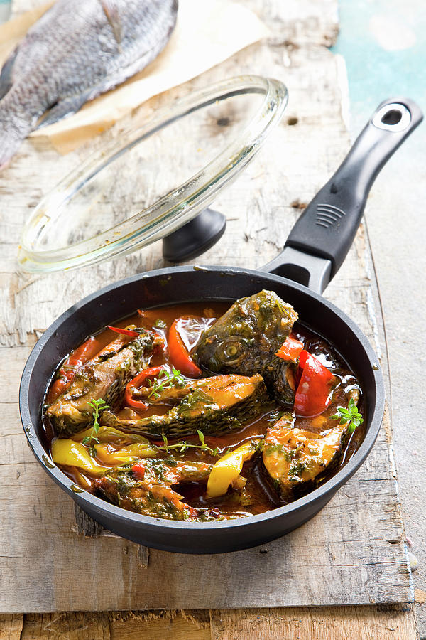 Moroccan-style Fried Fish With Peppers And Herbs Photograph by Danny Lerner