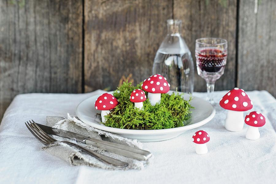 Moss And Hand-made Toadstool Ornaments On Plate Photograph by Patsy&christian