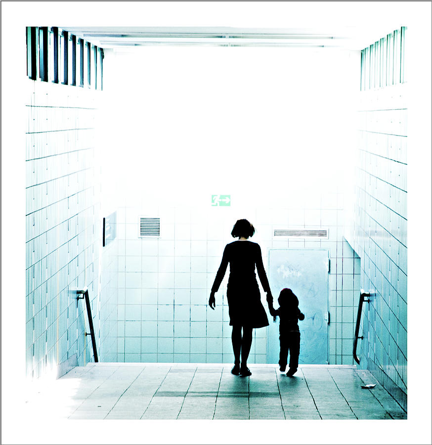 Mother And Child Walking Through Urban Photograph by Mtvision