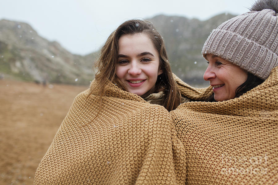 Mother And Daughter Wrapped In A Blanket On Beach Photograph By Caia