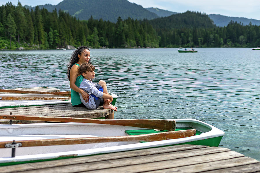 Mother And Son Sitting On A Landing Stage At Lake Hintersee Photograph ...