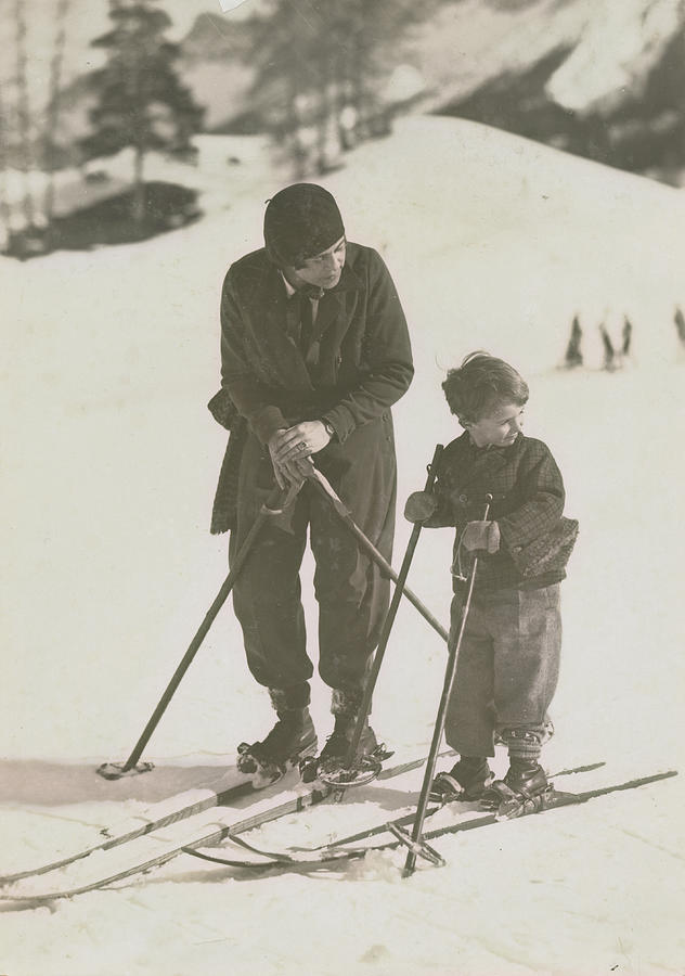 Mother And Son Skiing Photograph by Kurt Hutton