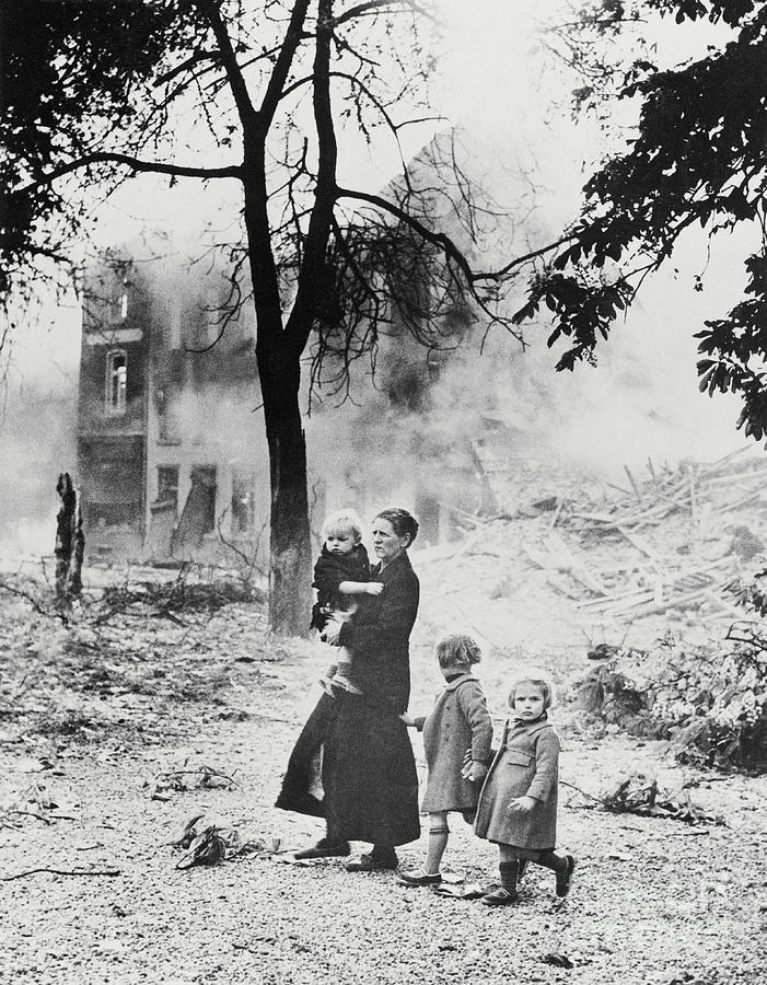 Mother Fleeing With Children Photograph by Bettmann