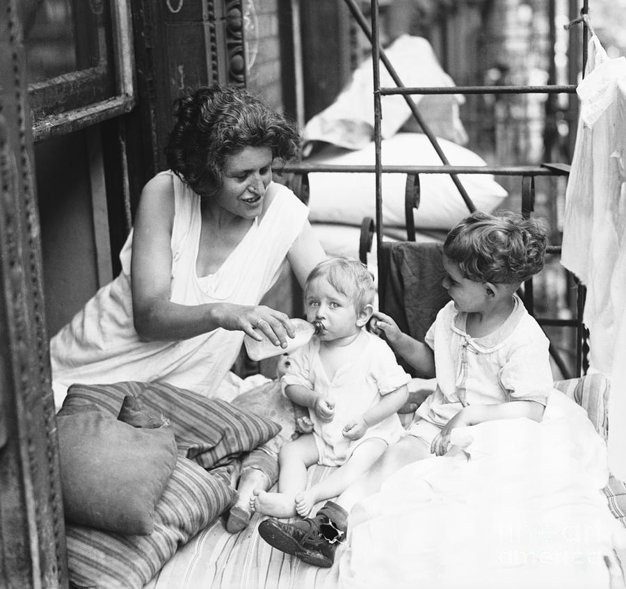 Mother With Her Children On Fire Escape Photograph by Bettmann