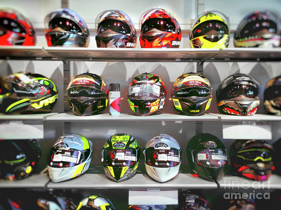 Motorbike Sports Helmets On The Shelves Of A Specialized Shop Photograph by Luca Lorenzelli