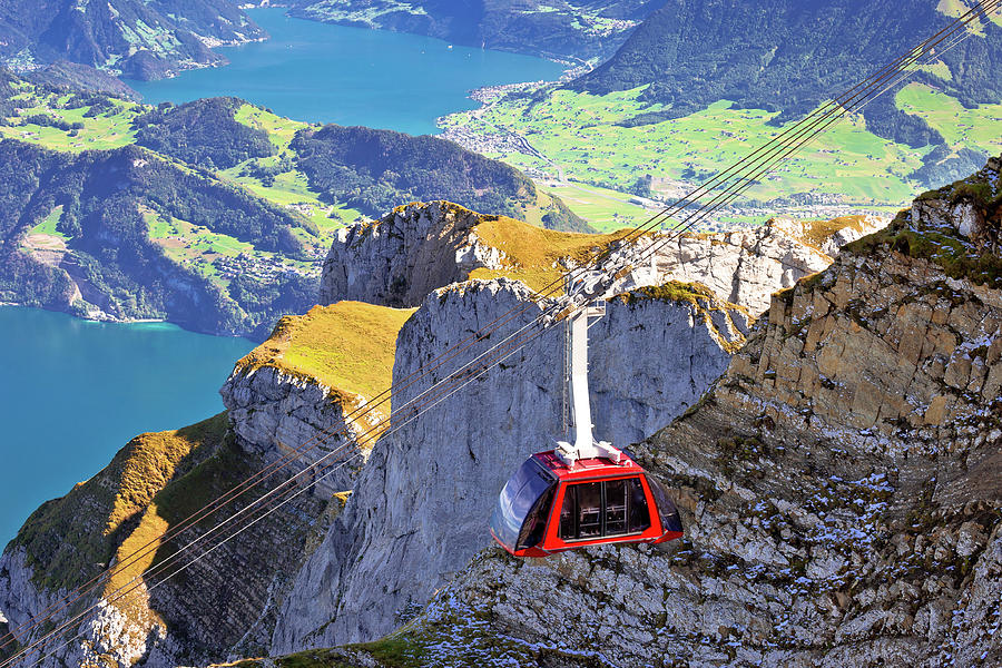 Mount Pilatus aerial cabelway above cliffs and Lake Lucerne land