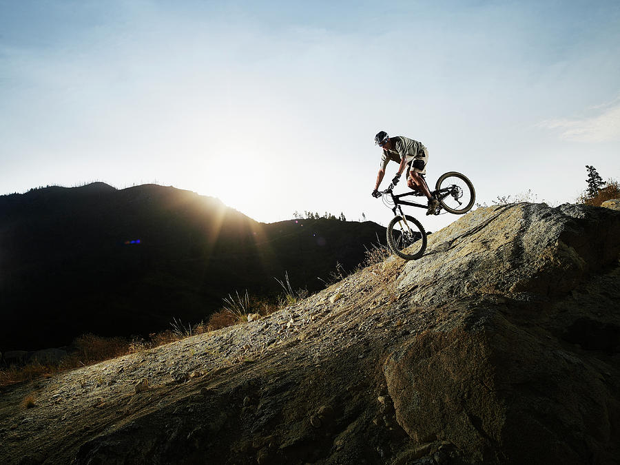 Mountain Biker Descending On Slick Rock Photograph by Thomas Barwick