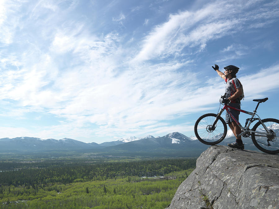 Mountain Biker On Top Of Rock With Photograph by Ascent/pks Media Inc.