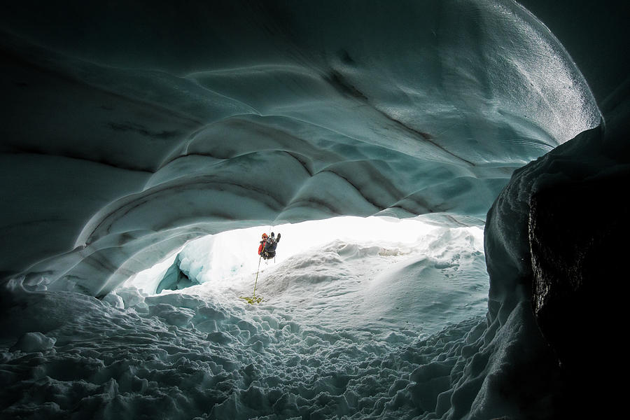 Mountaineer And Explorer Rappels Into Glacial Ice Cave To Have A Look ...