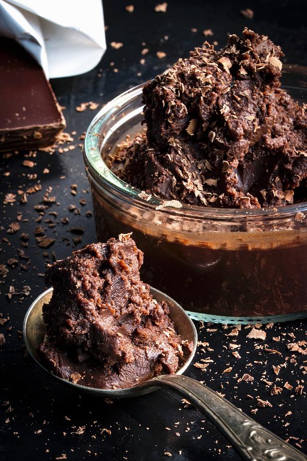 Mousse Au Chocolat With Chocolate Sprinkles In A Jar And On A Spoon Photograph by Charlotte Von Elm
