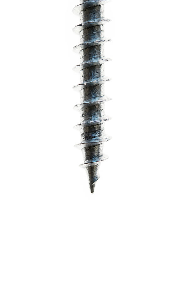 Moving Screw Against White Background Photograph by Elliot Elliot