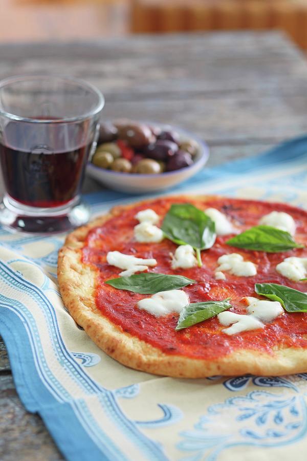 Mozzarella And Tomato Pizza With Basil Photograph by Perry Jackson