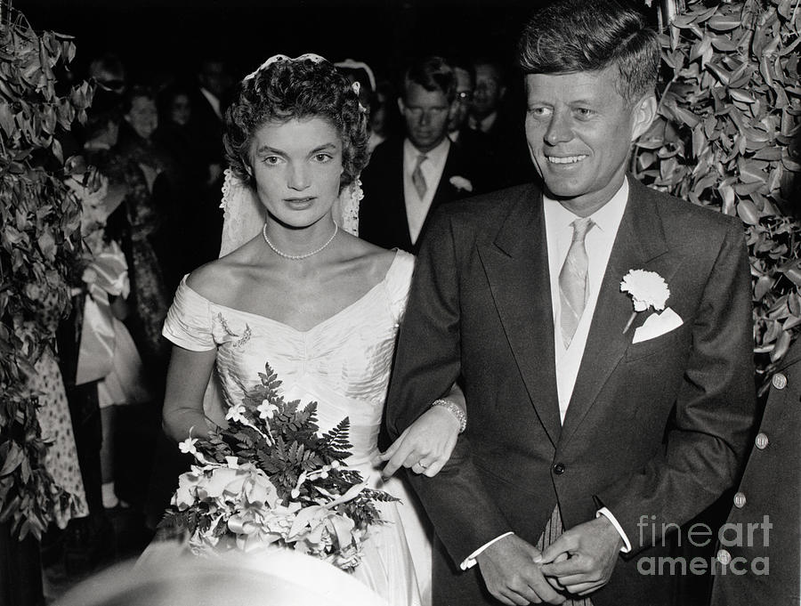 Mr. And Mrs. John F. Kennedy Walking by Bettmann