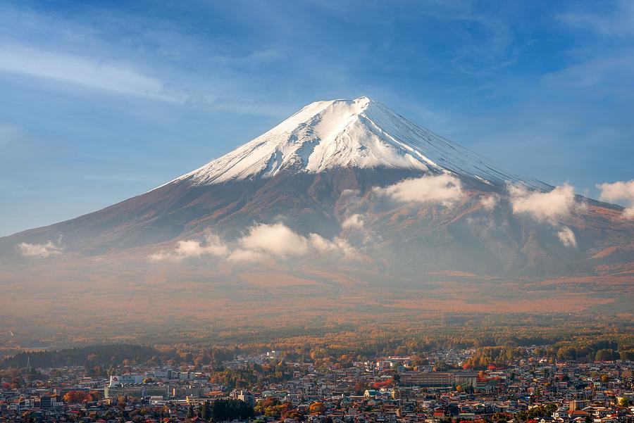 Mt. Fuji Towers Over Fujiyoshida, Japan Photograph by Sean Pavone ...