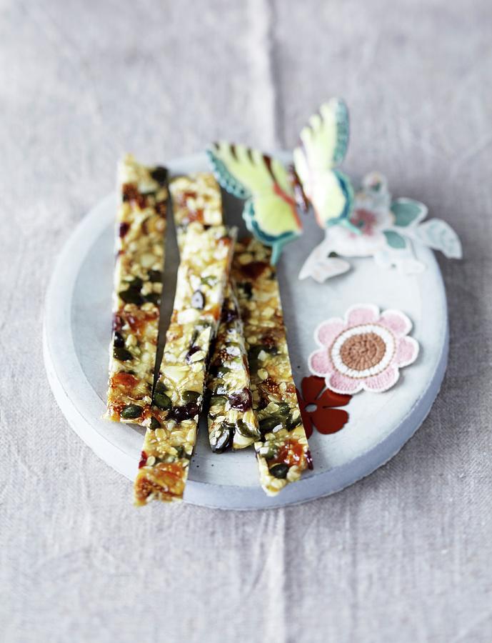 Muesli Bars With Dried Fruits Photograph by Jalag / Janne Peters