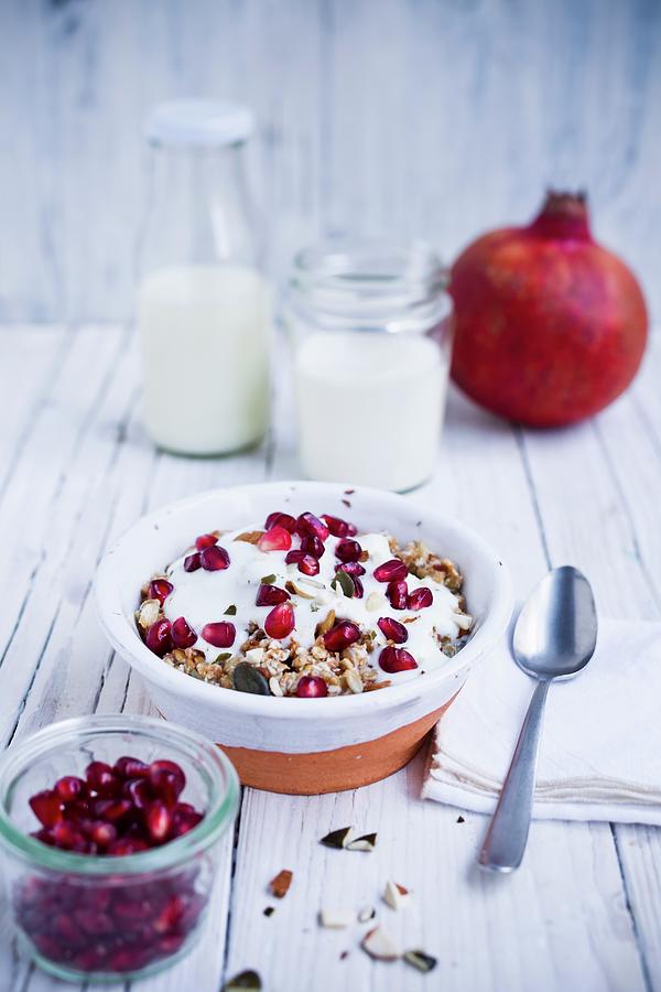 Muesli With Pomegranate, Yoghurt And Almonds Photograph by Brigitte Sporrer