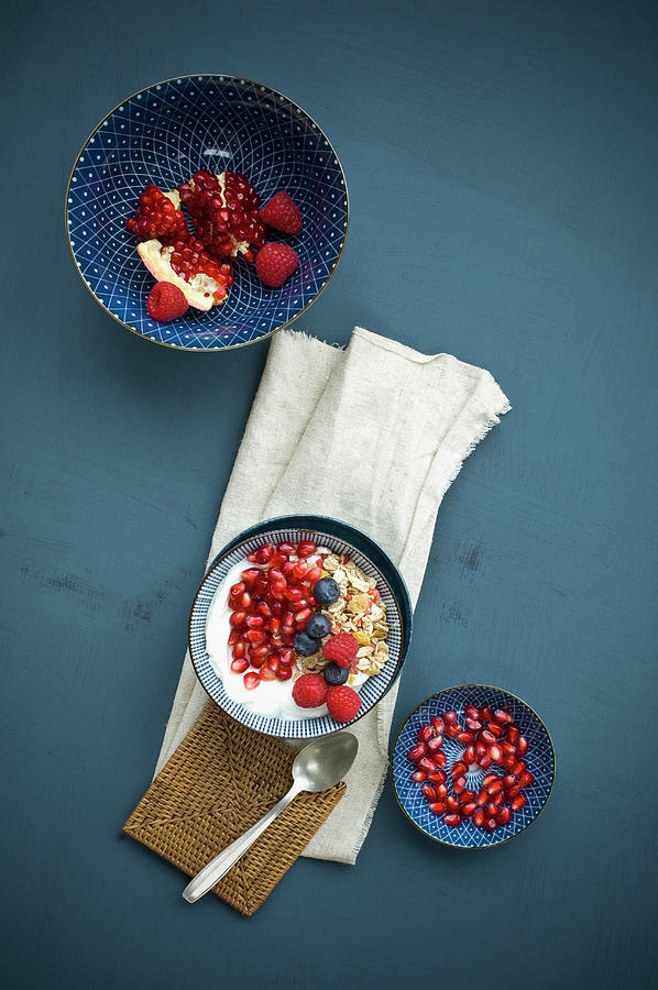 Muesli With Yoghurt, Pomegranate Seeds, Blueberries And Raspberries top View Photograph by Achim Sass