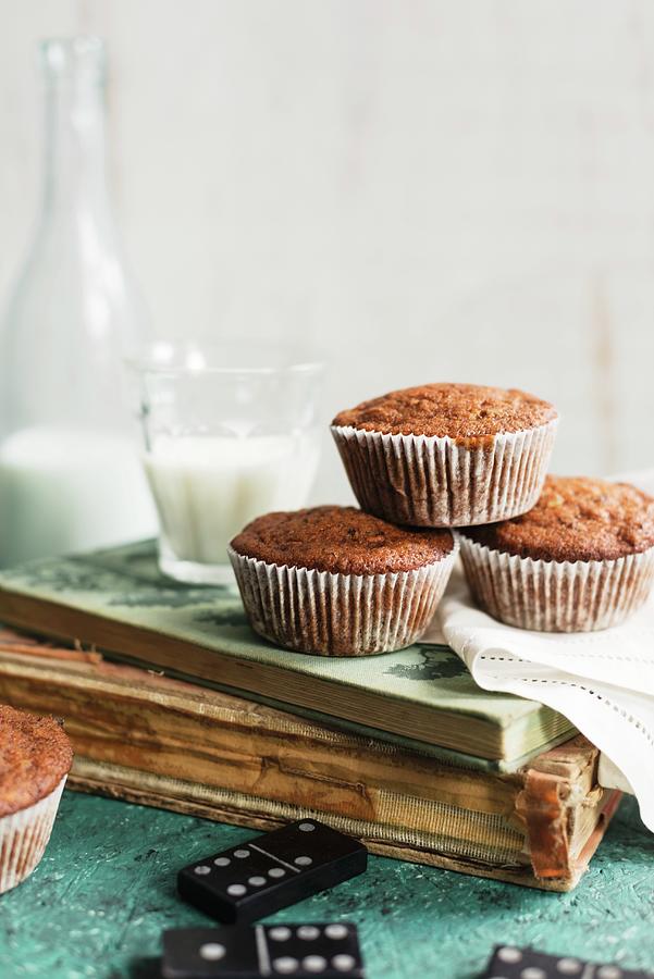 Muffins And Milk On An Old Book Photograph by Sarka Babicka