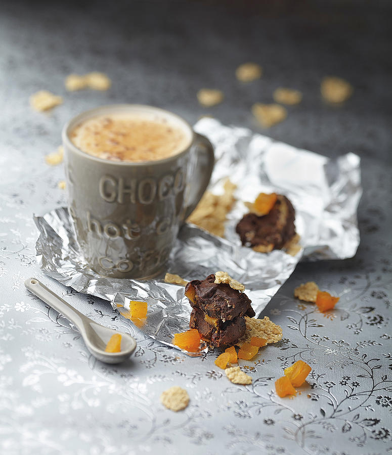 Mug Of Hot Chocolate And Chocolate,dried Apricot,almond And Fig Cereal Bars Photograph by Scuiz In