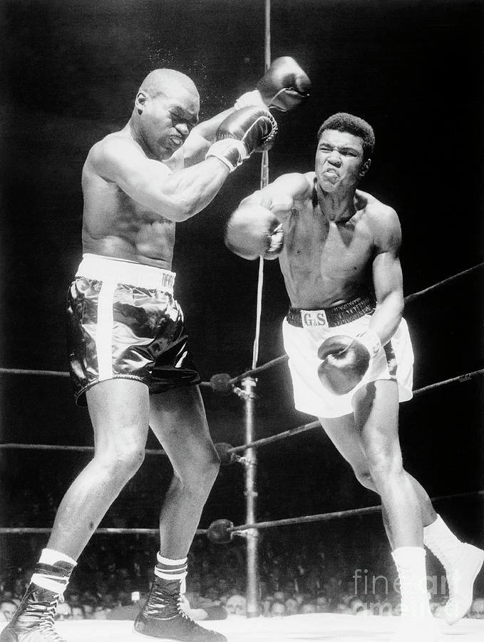 Muhammad Ali Boxing Against Doug Jones Photograph by Bettmann