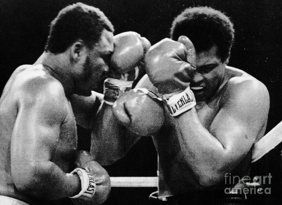 Muhammad Ali Covers As Joe Frazier Punch Photograph by Bettmann