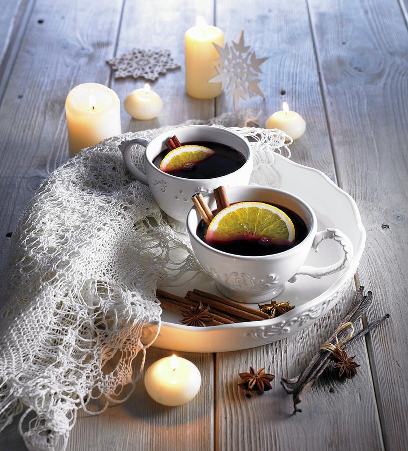 Mulled Wine In White Cups By Candlelight Photograph by Magdalena & Krzysztof Duklas