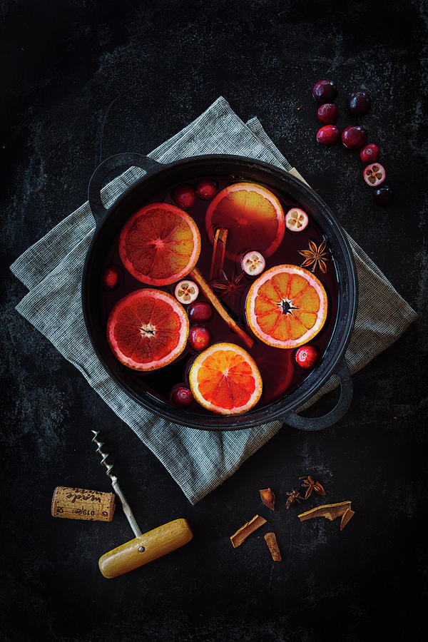 Mulled Wine With Cranberries And Blood Oranges Photograph by Jan Wischnewski