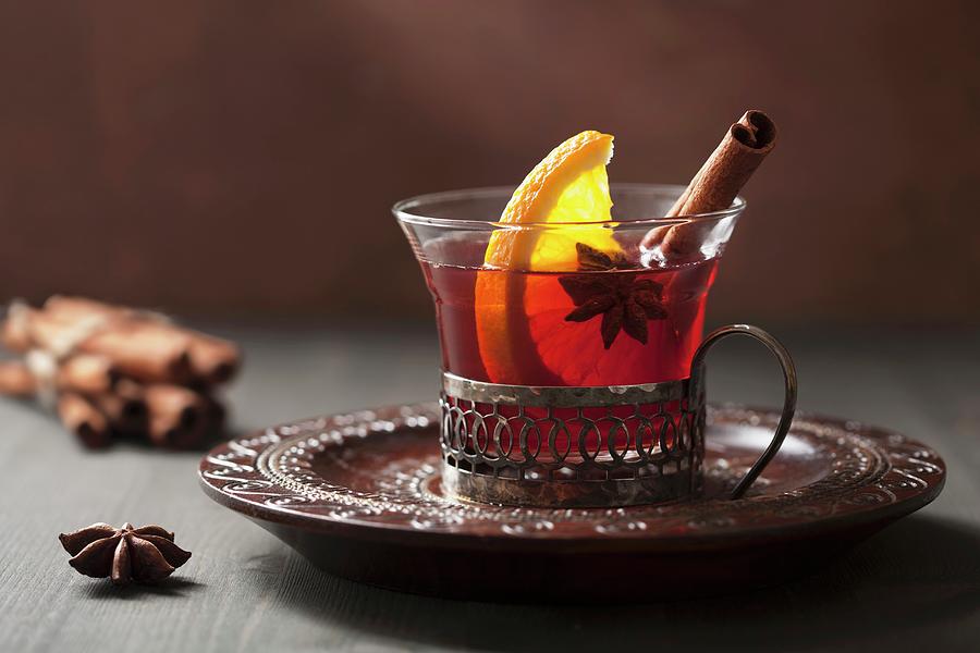 Mulled Wine With Orange, Cinnamon And Star Anise Photograph by Olga Miltsova