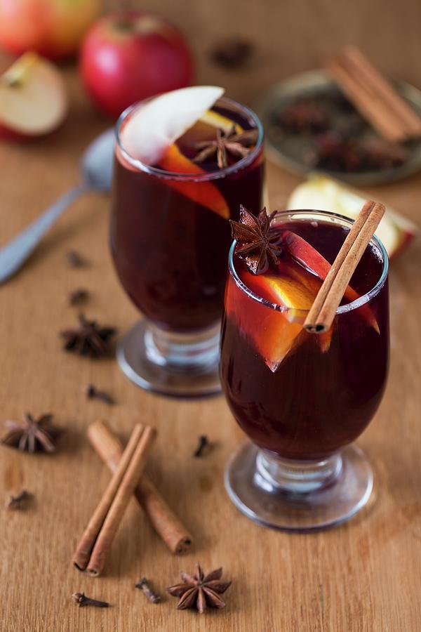 Mulled Wine With Oranges, Apples And Spices Photograph by Malgorzata Laniak