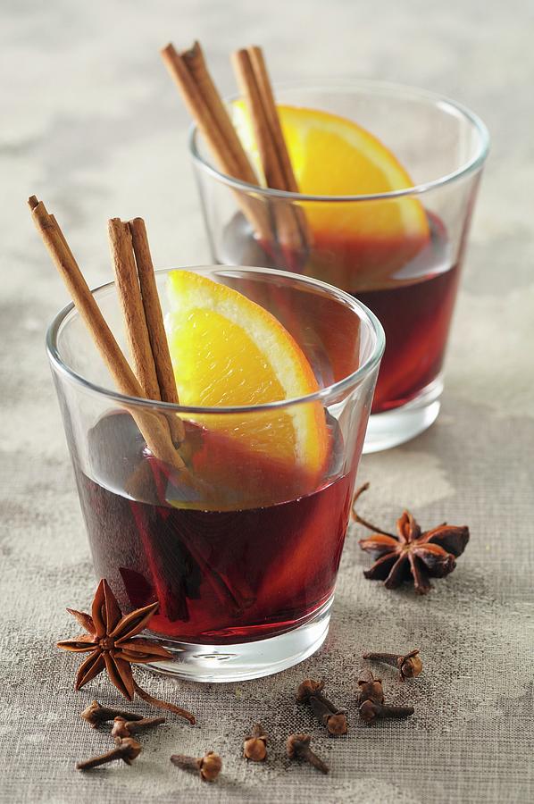Mulled Wine With Spices And Orange Wedges Photograph by Jean-christophe Riou