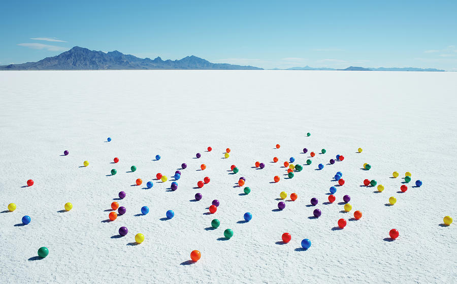 Multi-colored Balls On Salt Flats Photograph by Andy Ryan