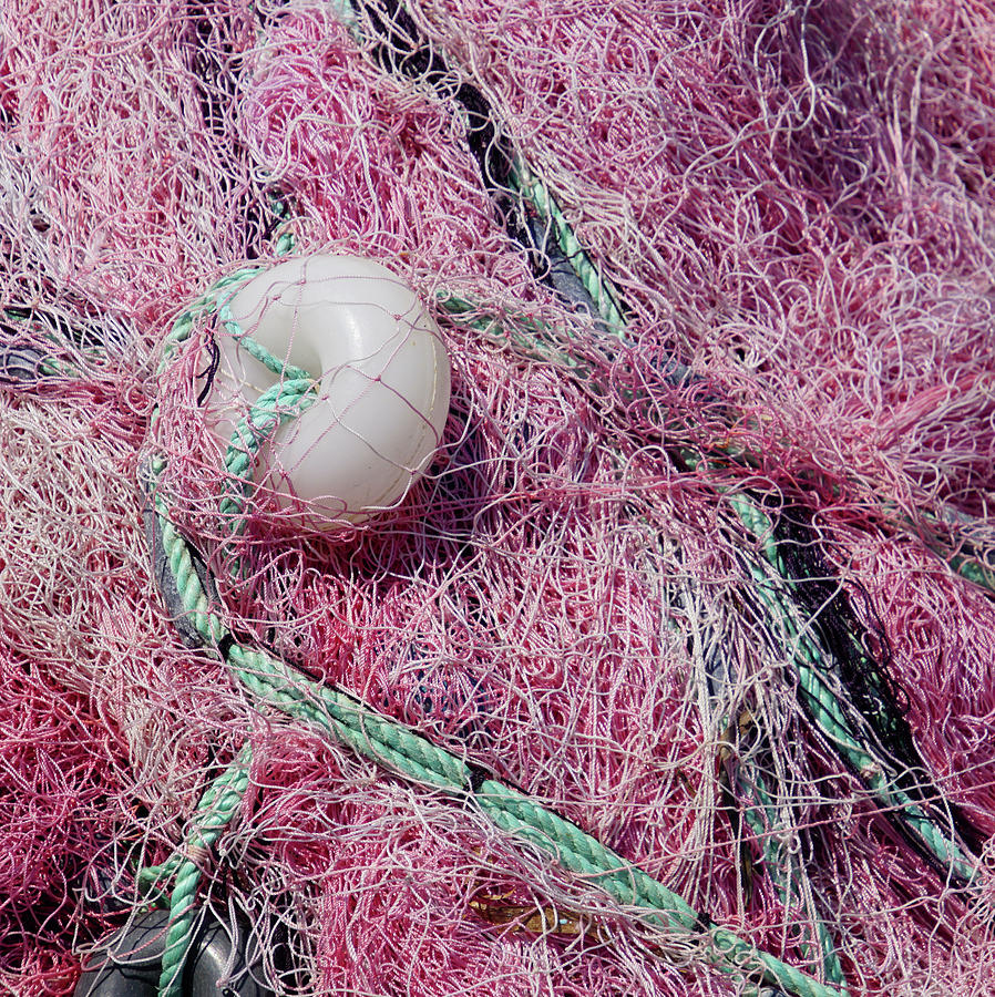 Multi-colored nylon fishing nets and floats Photograph by Steve Estvanik