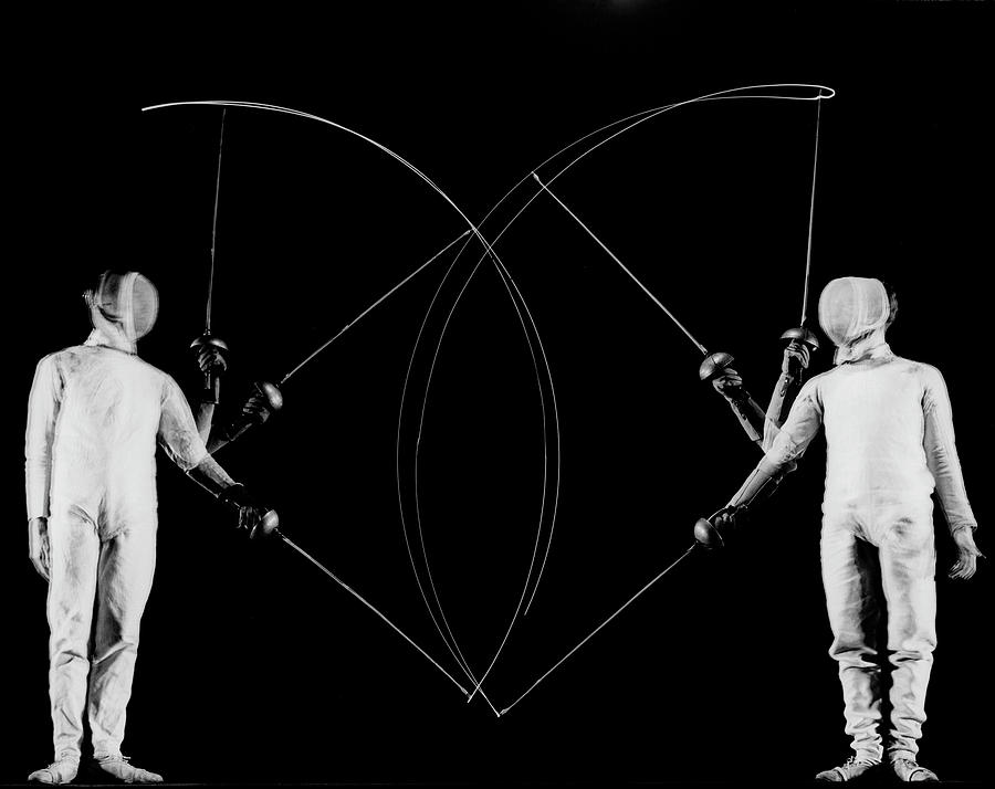 Archival Photograph - Multiple exposure showing movement of fencers Arthur Tauber (L) & Seymour Gross captured by lights on the tips of their blades. by Gjon Mili