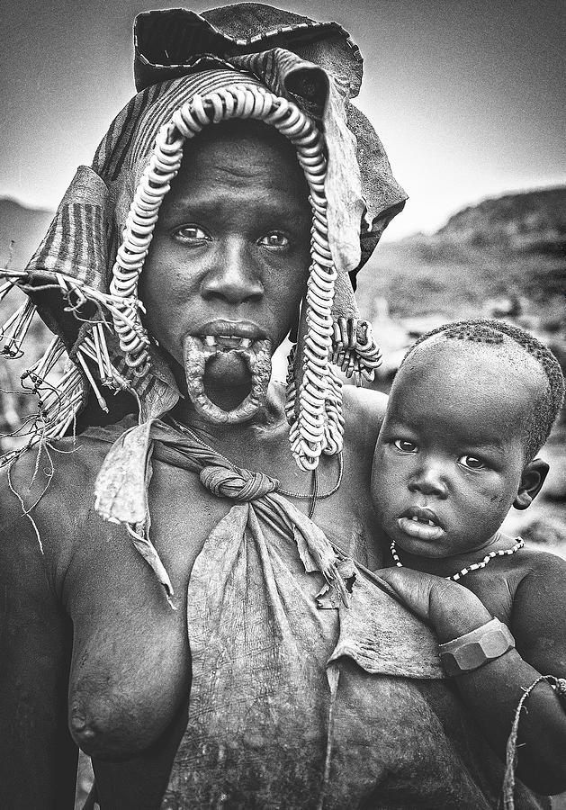 Mursi Woman With Her Child (omo Valley - Ethiopia) Photograph by Joxe Inazio Kuesta Garmendia