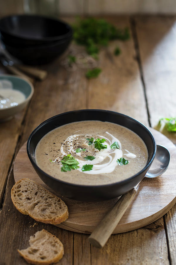 Mushroom Soup With Soured Cream And Parsley Garnish, Bread On A Side Photograph by Magdalena Hendey