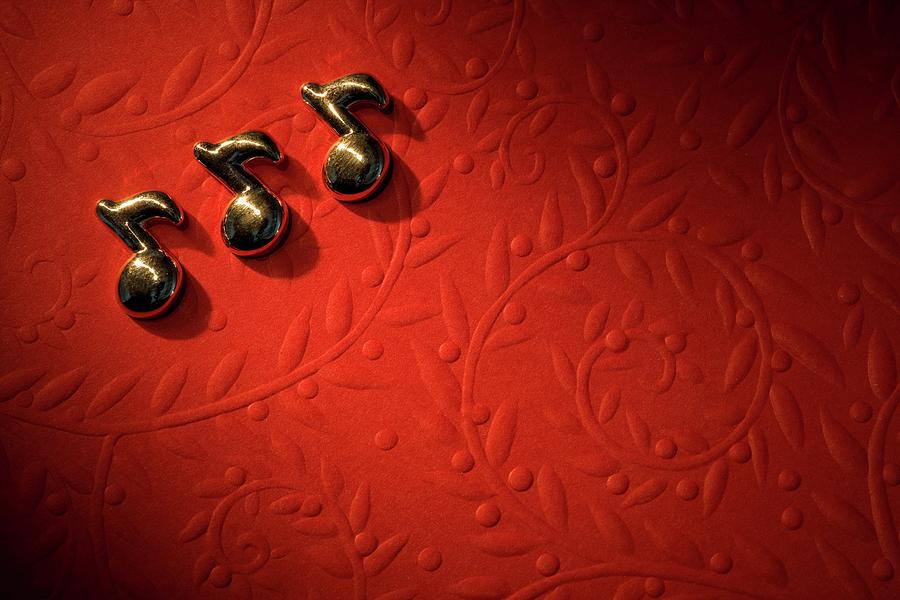 Musical Notes On The Red Background by Design Pics
