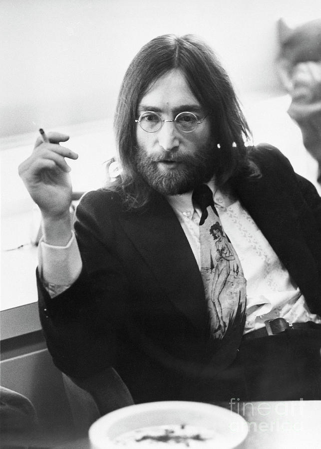 Musician John Lennon Smoking Photograph by Bettmann