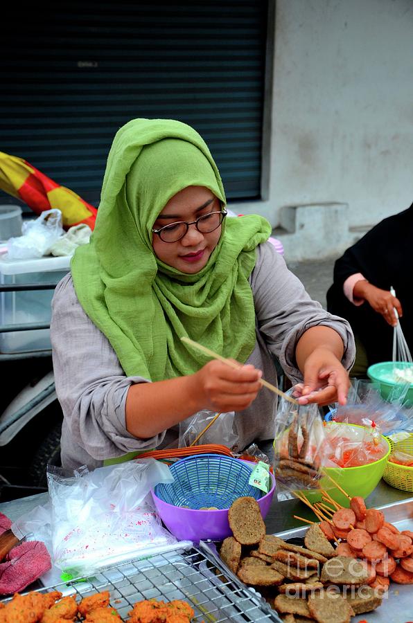 Muslim Thai woman cook at street stall at food street bazaar Pattani Thailand Photograph by Imran Ahmed
