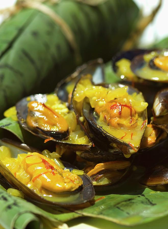 Mussels With Saffron And White Wine Sauce, Served In Banana Leaves Photograph by Great Stock!