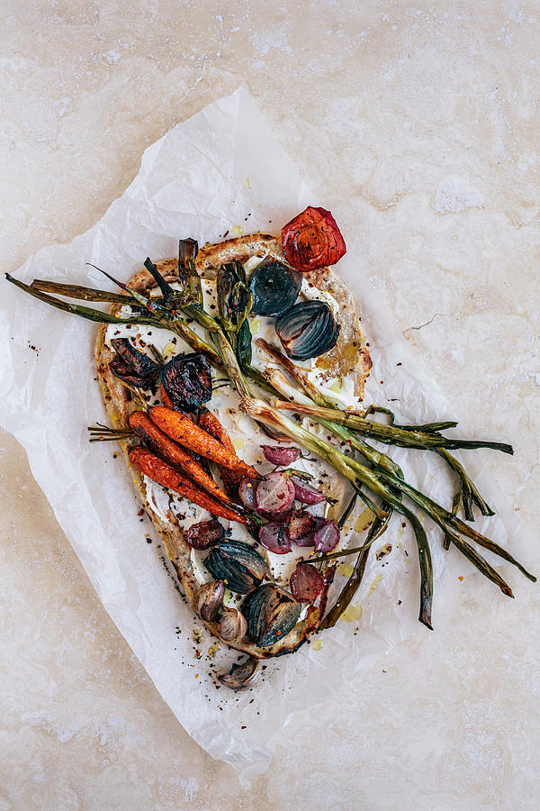 Naan Flatbread With Roasted Onions, Leeks, Radish And Carrots Photograph by Hein Van Tonder