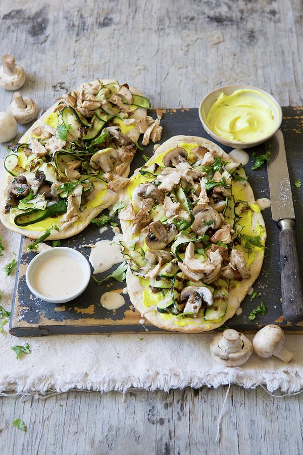 Naan Pizzas Topped With Chicken And Vegetables, With Peanut And Coconut Sauce Photograph by Great Stock!