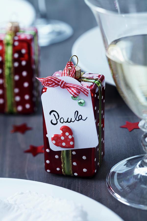Name Tag On Christmas Tree Decoration In Shape Of Wrapped Present Photograph by Franziska Taube