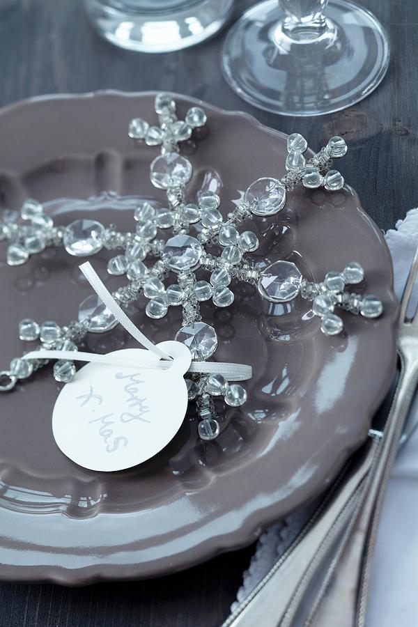 Name Tag On Glass Snowflake On Plate Photograph by Franziska Taube