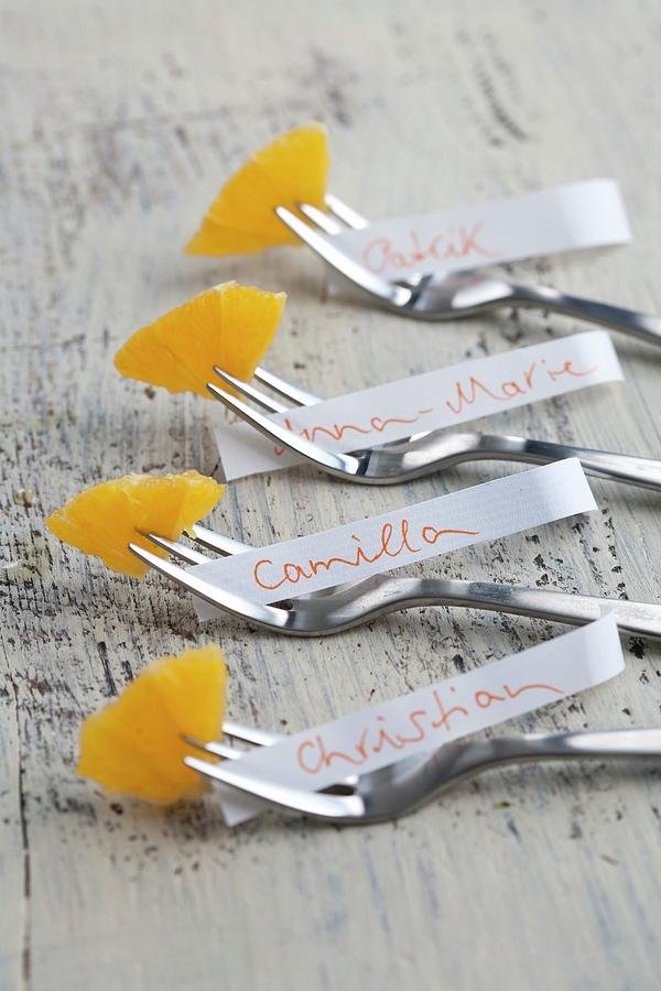 Name Tags And Orange Segments On Cake Forks Photograph by Schindler, Martina