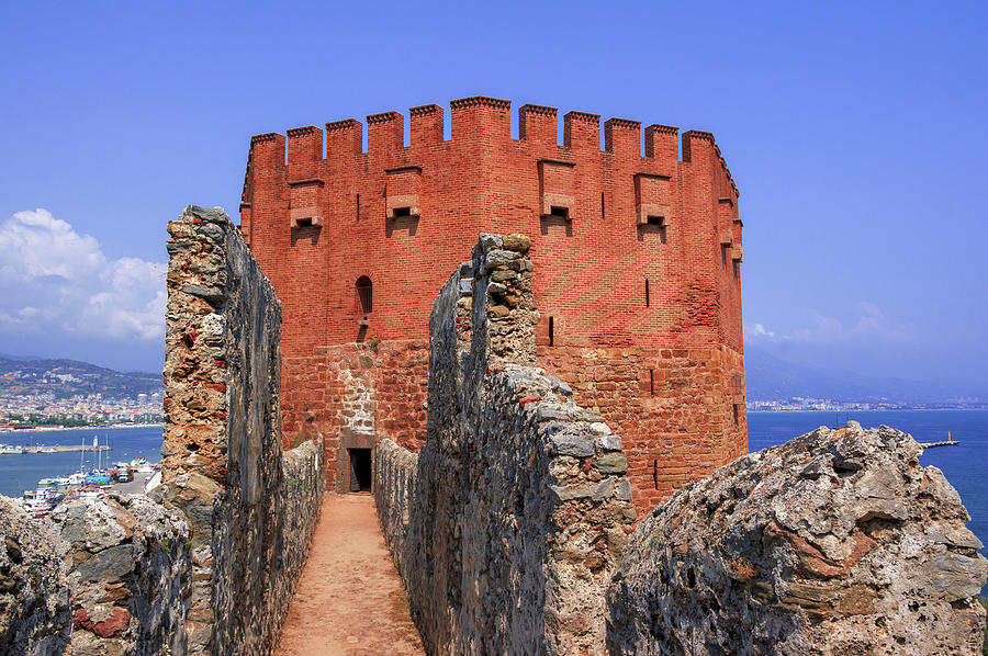 Narrow path to the red tower in Alanya Photograph by Sun Travels