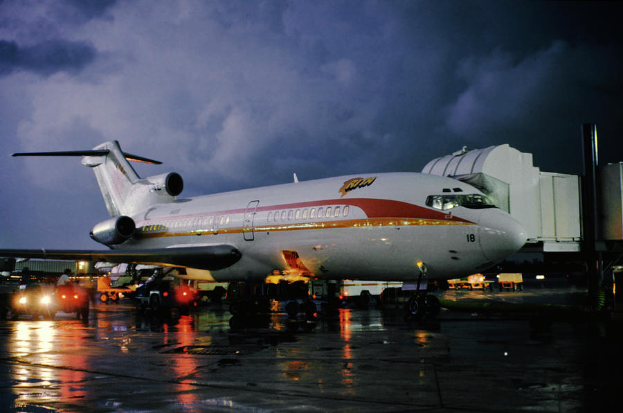 National Airlines Boeing 727 on a Rainy Night in Miami Photograph by Erik Simonsen