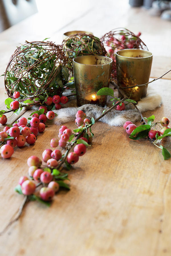 Natural Arrangement With Crab Apples And Tealights On Wooden Table Photograph by Jansje Klazinga