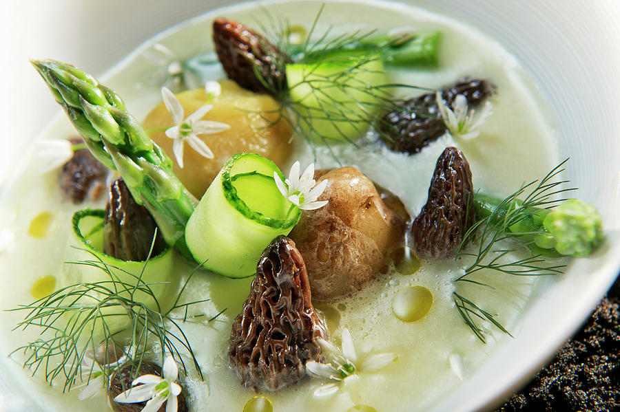 Natural Cuisine: Cream Of Potato Soup With Morel Mushrooms, Asparagus And Edible Flowers Photograph by Lode Greven Photography