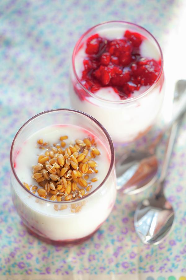 Natural Yoghurt With Raspberry Jam And Wheat Sprouts In Glasses Photograph by Studio Lipov